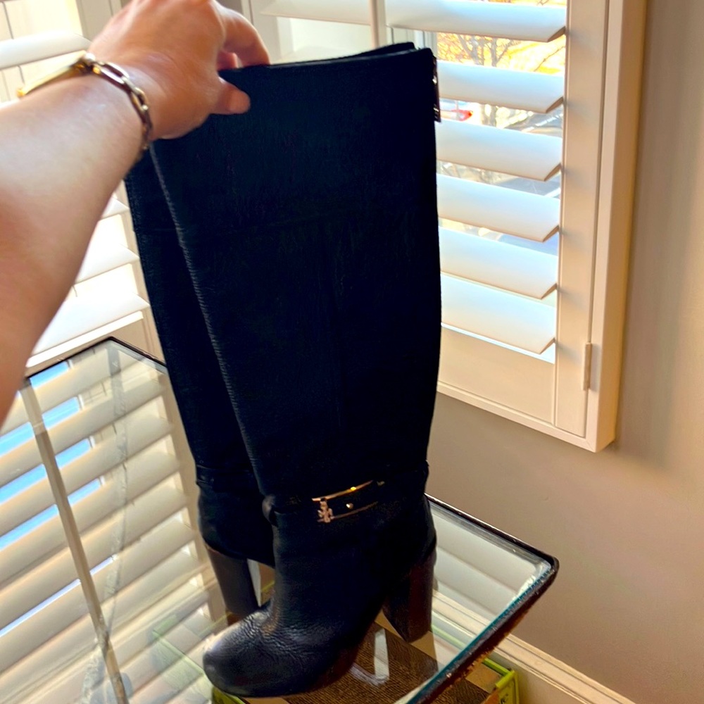Tory Burch size 6 black tall boot with logo buckle.